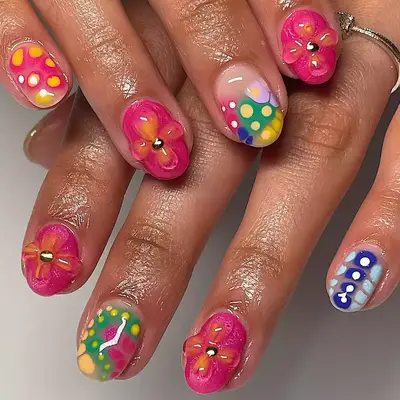 A short mani with dot accents and 3D builder gel flowers