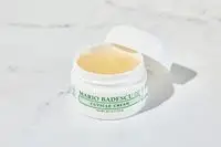Mario Badescu Cuticle Cream sitting on a marble bathroom counter