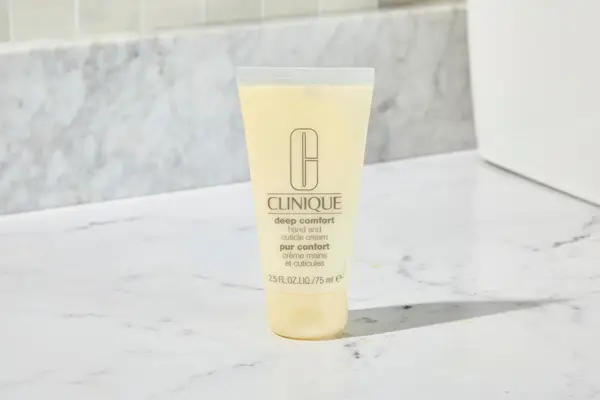 Clinique Deep Comfort Hand and Cuticle Cream on a marble counter