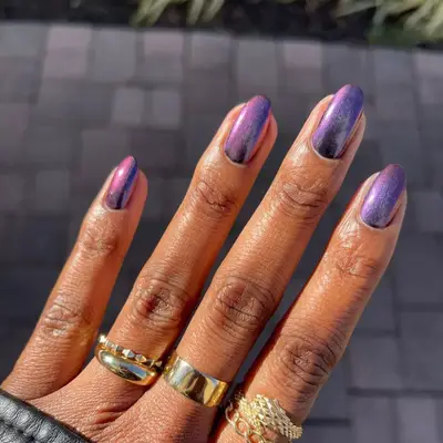 short black nails with gold stars on one nail