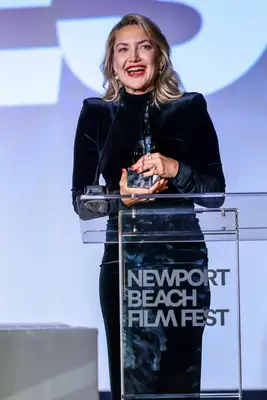 Kate Hudson wears red lipstick and nail polish at the Newport Beach Film Fest.