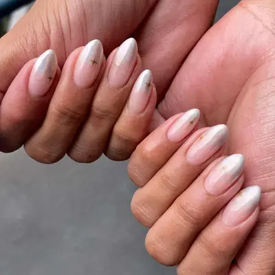 a manicure with chrome ombre tips