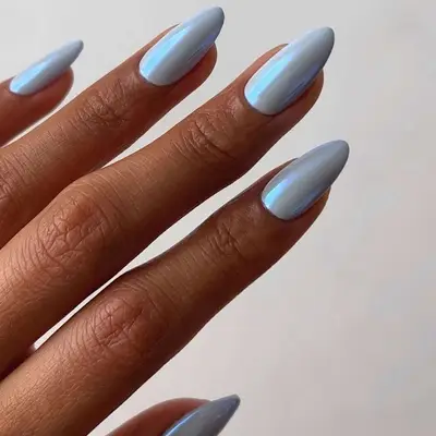 an icy blue chrome manicure