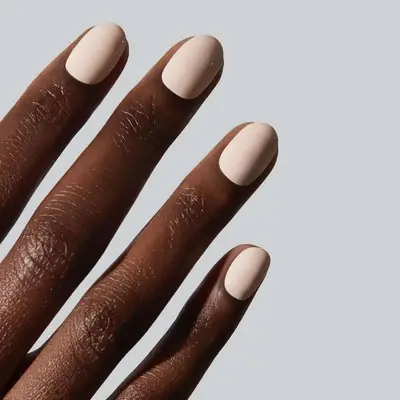 a short, subtle beige manicure