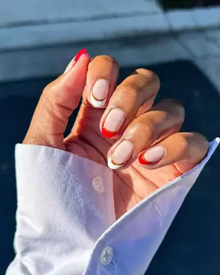 Red, white, and gold candycane themed french manicure