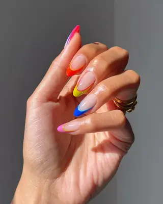 Double French manicure with yellow, orange, pink, and blue neon tips