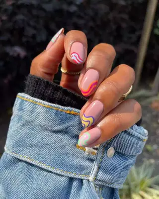 French manicure with swirly colorful tips 