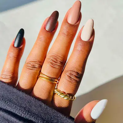 black, brown, beige and white nails