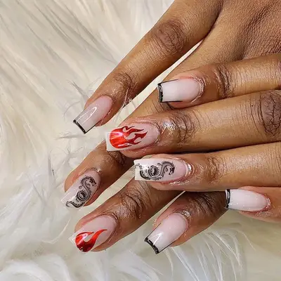 Nail design with black dragons and red flames