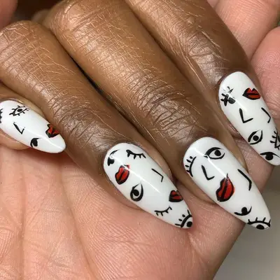Black, red, and white face nail design