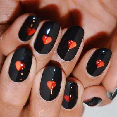 Black and red heart nail design