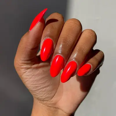 A solid, tomato red manicure