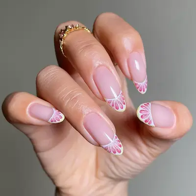 a manicure with 3D citrus fruit french tips