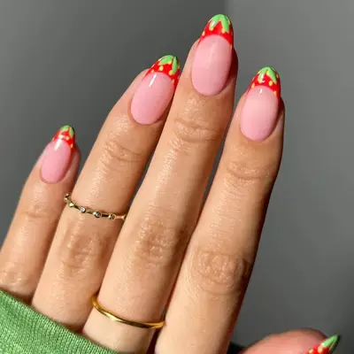 a french manicure with strawberry tips