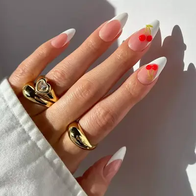 a classic french manicure topped with builder gel cherries