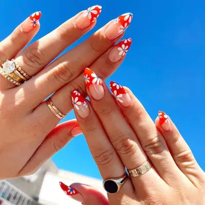 red, white, and blue daisy nails