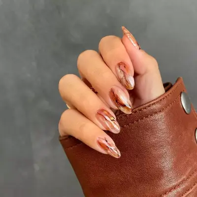 brown marble nails with gold leaf specks
