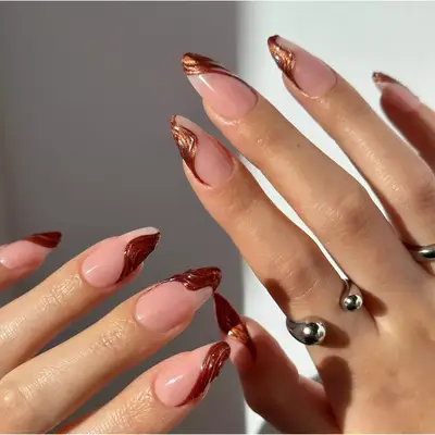 shimmery copper asymmetrical swoop nails