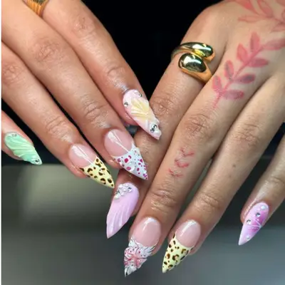 Animal print manicure in summer colors on short stiletto shaped nails.