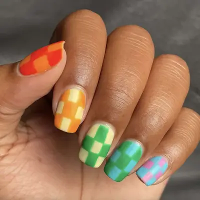 A mismatched checkerboard manicure