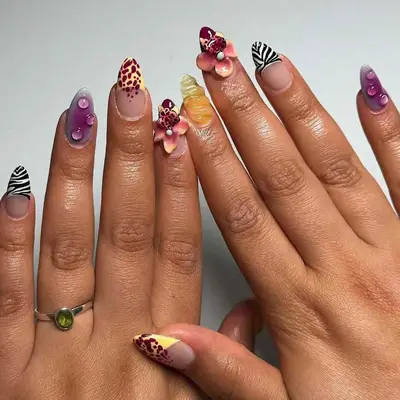 Manicured hands with decorated nails in various artistic designs