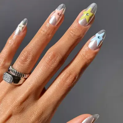 silver nails with pastel stars and rhinestones