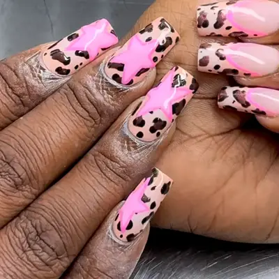 animal print nails with got pink stars