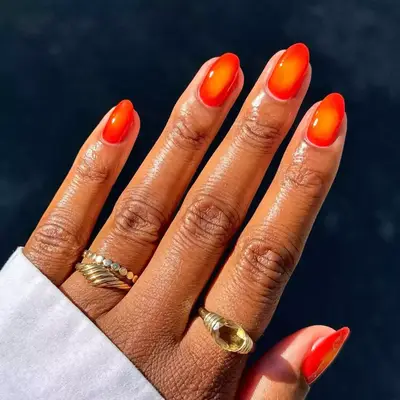 Short bright orange aura nails