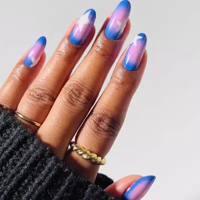 Blue and pink aura nails with white star details