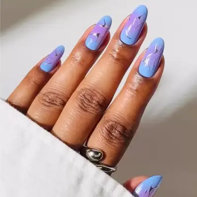 Pastel blue and purple aura nails with silver chrome detail