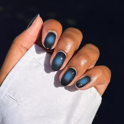 Short black nails with blue aura center