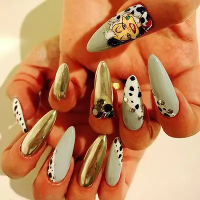 Long acrylic nails with Cruella de Vil design and dalmatian pattern