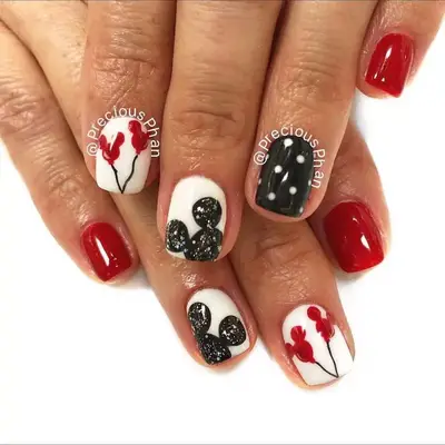 Red, black, and white manicure with Mickey Mouse balloon details