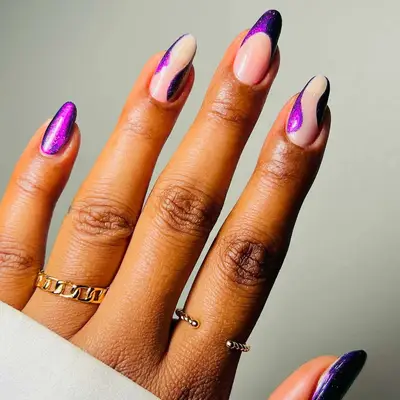 Royal purple swirl manicure with a milky white base