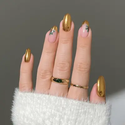 manicure with green christmas nails with snowflakes, holly, etc