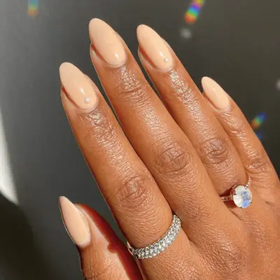 Almond-shaped nails with white and rose gold glitter design