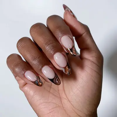 French manicure with brown tips with copper metallic accents