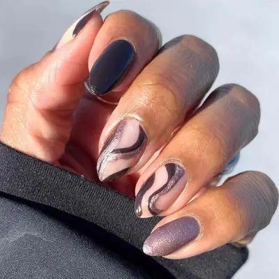 Metallic brown manicure with swirl accent nails