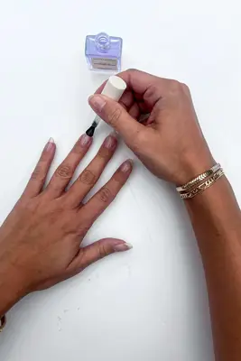 A collage featuring a testers hand holding a bottle of ORLY Nailtrition Nail Growth Treatment while showing the application and final results