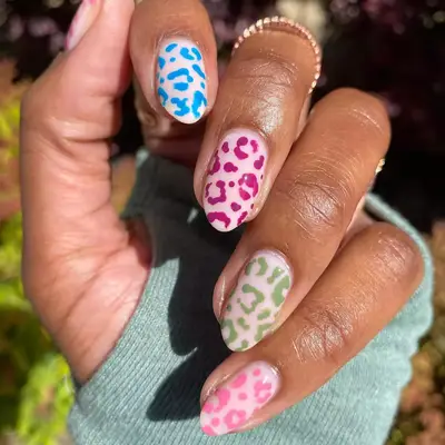 milky manicure with cheetah design