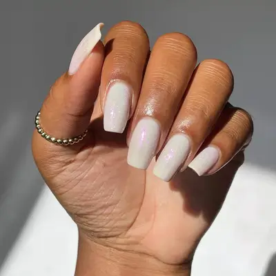 milky nails with glitter topper