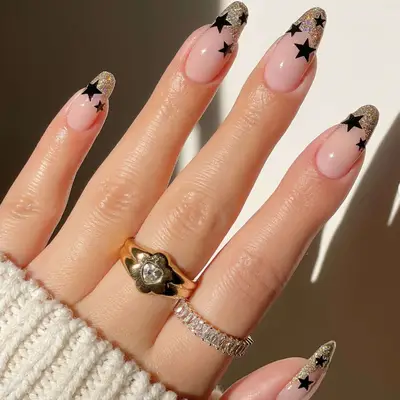 gold french tips with black star nail stickers