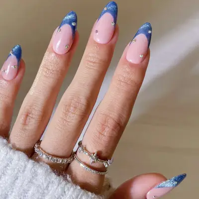 Blue french tips with gemstones