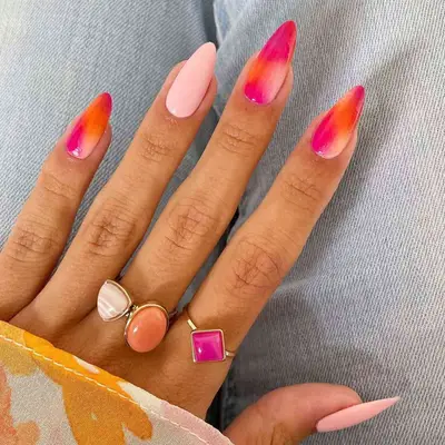 Long almond nails with pink and orange ombre