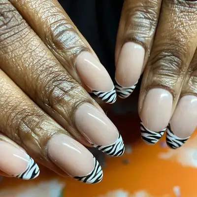 Manicure with zebra print French tips