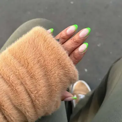 Medium-length nails with neon green French tips