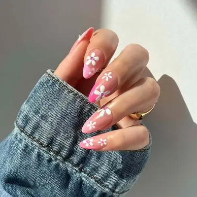 Pink French manicure with daisies and pink rhinestones