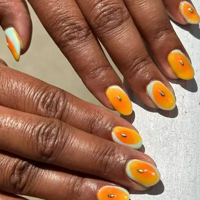 Marigold Yellow abstract nail art with gold accents 