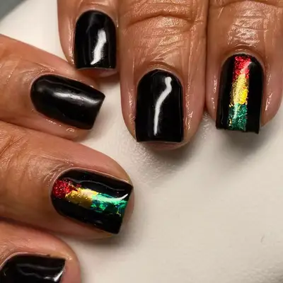 Glossy Black nails with red, yellow, and green foil stripes