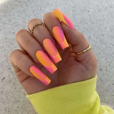 Pink and orange ombre illusion square French tips featuring a dual-tone finish